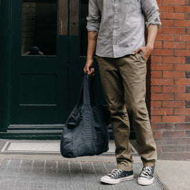 fit model walking holding The Foundation Tote in Organic Navy, Accessories by Taylor Stitch