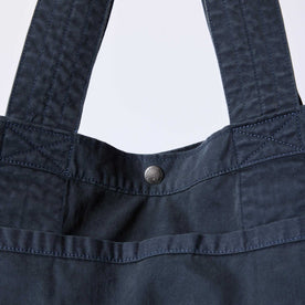 editorial image of the button snap on The Foundation Tote in Organic Navy, Accessories by Taylor Stitch