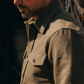 fit model showing off the sleeves on The Maritime Shirt Jacket in Fatigue Olive Moleskin Twill, Outerwear by Taylor Stitch