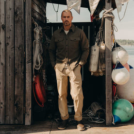 fit model posing in The Maritime Shirt Jacket in Fatigue Olive Moleskin Twill, Outerwear by Taylor Stitch