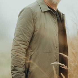 fit model showing off the buttons on The Ridgeline Overshirt in Fatigue Olive, Wovens by Taylor Stitch