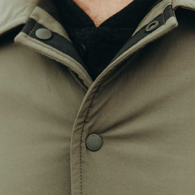 fit model showing off the buttons on The Ridgeline Overshirt in Fatigue Olive, Wovens by Taylor Stitch