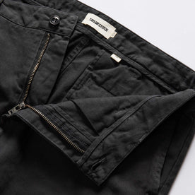 material shot of the zipper on The Slim Foundation Pant in Organic Faded Black, Bottoms by Taylor Stitch