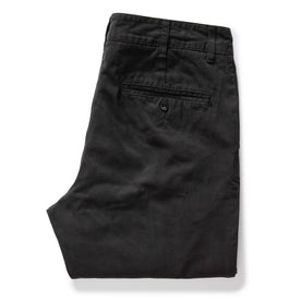 folded flatlay of the back of The Slim Foundation Pant in Organic Faded Black, Bottoms by Taylor Stitch