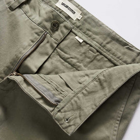 material shot of the zipper on The Slim Foundation Pant in Organic Smoked Olive, Bottoms by Taylor Stitch