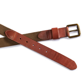 editorial flatlay of the buckle and belt holes on The Webbed Belt in Whiskey, Accessories by Taylor Stitch