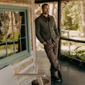 fit model leaning against the wall wearing The Camp Pant in Aged Penny Chipped Canvas, Bottoms by Taylor Stitch