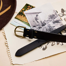 editorial image of The Foundation Belt in Black on a stack of paper, Accessories by Taylor Stitch