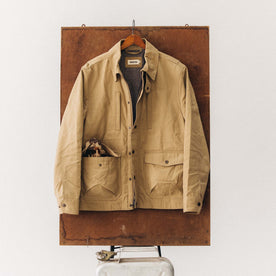 editorial image of The Pathfinder Jacket in Khaki Dry Wax hanging, Outerwear by Taylor Stitch