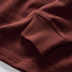 material shot of the sleeves on The Rugby Shirt in Dried Cherry Stripe, Knits by Taylor Stitch