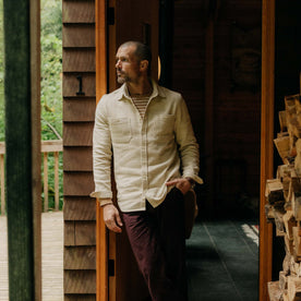 fit model leaning against the wall in The Utility Shirt in Natural Sashiko, Wovens by Taylor Stitch