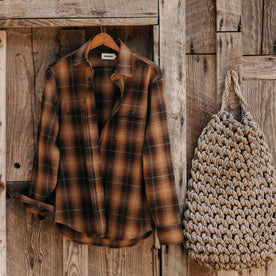 editorial image of The Yosemite Shirt in Bonfire Plaid hanging, Wovens by Taylor Stitch