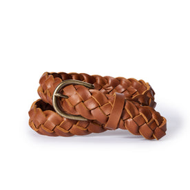 editorial image of The Braided Belt in Whiskey rolled up, Accessories by Taylor Stitch