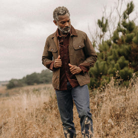 fit model walking wearing The Long Haul Jacket in Dark Khaki Waxed Canvas, Outerwear by Taylor Stitch