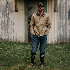 fit model with his hands in his pockets wearing The Deck Jacket in Khaki Dry Wax, Outerwear by Taylor Stitch