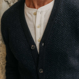 fit model showing off the texture on The Eddy Cardigan in Heather Marine Herringbone, Knits by Taylor Stitch