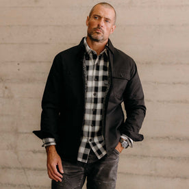 fit model with his hand in his pocket wearing The Fender Jacket in Coal Dry Wax, Outerwear by Taylor Stitch