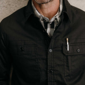 fit model showing off the pockets on The Fender Jacket in Coal Dry Wax, Outerwear by Taylor Stitch