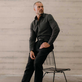 fit model sitting wearing The Jack in Roped Black Indigo, Wovens by Taylor Stitch