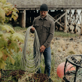 fit model holding rope wearing The Maritime Shirt Jacket in Ash Twill, Wovens by Taylor Stitch