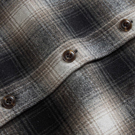 material shot of the buttons on The Maritime Shirt Jacket in Olive Plaid, Wovens by Taylor Stitch