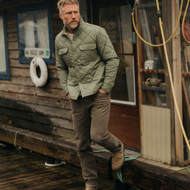 fit model with his hands in his pockets wearing The Miller Shirt Jacket in Smoked Olive Dry Wax, Outerwear by Taylor Stitch