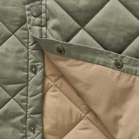 material shot of the buttons on The Miller Shirt Jacket in Smoked Olive Dry Wax, Outerwear by Taylor Stitch