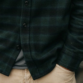 fit model with his hand in his pocket wearing The Moto Utility Shirt in Black Pine Plaid, Wovens by Taylor Stitch