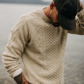 fit model posing in The Orr Sweater in Marled Oat Merino, Knits by Taylor Stitch