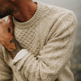 fit model showing off the texture on The Orr Sweater in Marled Oat Merino, Knits by Taylor Stitch