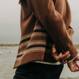 fit model showing off the cuffs The Ranger Shirt in Tarnished Copper Blanket Stripe, Wovens by Taylor Stitch