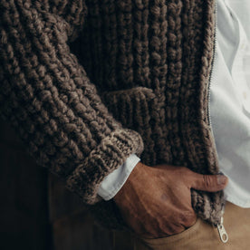 fit model with his hand in his pocket wearing The Seawall Hand-Knit Sweater in Heather Sable, Knits by Taylor Stitch