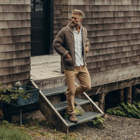 fit model walking down the stairs wearing The Seawall Hand-Knit Sweater in Heather Sable, Knits by Taylor Stitch