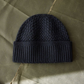 editorial flatlay of The Textured Knit Beanie in Heather Navy Merino, Accessories by Taylor Stitch