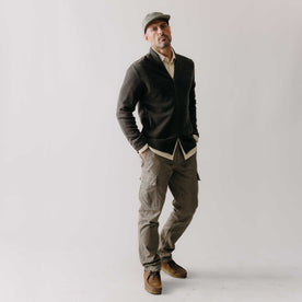 fit model with his hands in his pockets wearing The Tommie Pant in Fatigue Olive, Bottoms by Taylor Stitch