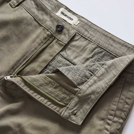 material shot of the zipper fly on The Tommie Pant in Fatigue Olive, Bottoms by Taylor Stitch