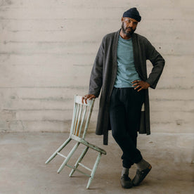 fit model leaning against a chair wearing The Apres Robe in Charcoal Sashiko, Accessories by Taylor Stitch