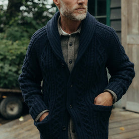 fit model with his hands in his pockets wearing The Cascade Shawl Cardigan in Heather Marine, Knits by Taylor Stitch