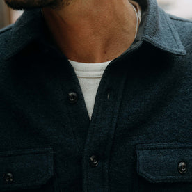 fit model showing off the buttons on The Connor Overshirt in Dark Navy Boucle, Wovens by Taylor Stitch