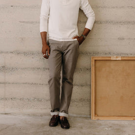 fit model leaning against the wall wearing The Morse Pant in Soil Herringbone, Bottoms by Taylor Stitch