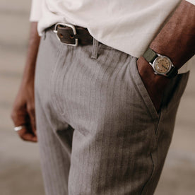 fit model with his hand in the pocket of The Morse Pant in Soil Herringbone, Bottoms by Taylor Stitch