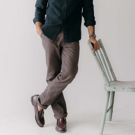 fit model leaning by a chair wearing The Morse Pant in Soil Herringbone, Bottoms by Taylor Stitch