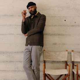 fit model leaning against the wall wearing The Ojai Jacket in Army Herringbone Wool, Outerwear by Taylor Stitch