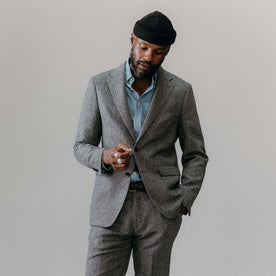 fit model posing in The Stevens Sportcoat in Slate Herringbone Wool, Outerwear by Taylor Stitch