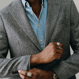 fit model adjusting the cuffs on The Stevens Sportcoat in Slate Herringbone Wool, Outerwear by Taylor Stitch