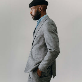 fit model showing off the side of The Stevens Sportcoat in Slate Herringbone Wool, Outerwear by Taylor Stitch