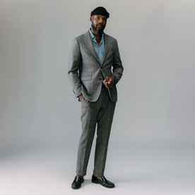 fit model standing wearing The Stevens Sportcoat in Slate Herringbone Wool, Outerwear by Taylor Stitch