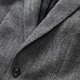 material shot of the collar and button on The Stevens Sportcoat in Slate Herringbone Wool, Outerwear by Taylor Stitch