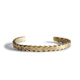 material shot of the front of The Twisted Cuff in Brass, Accessories by Taylor Stitch