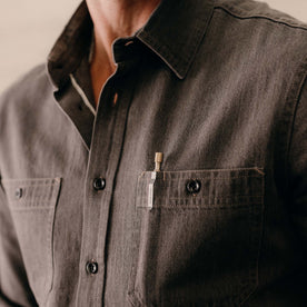 fit model showing off the pockets on The Utility Shirt in Soil Selvedge Denim, Wovens by Taylor Stitch